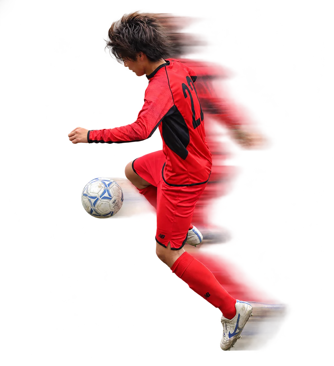 ボールをコントロールする赤いユニフォームの選手
